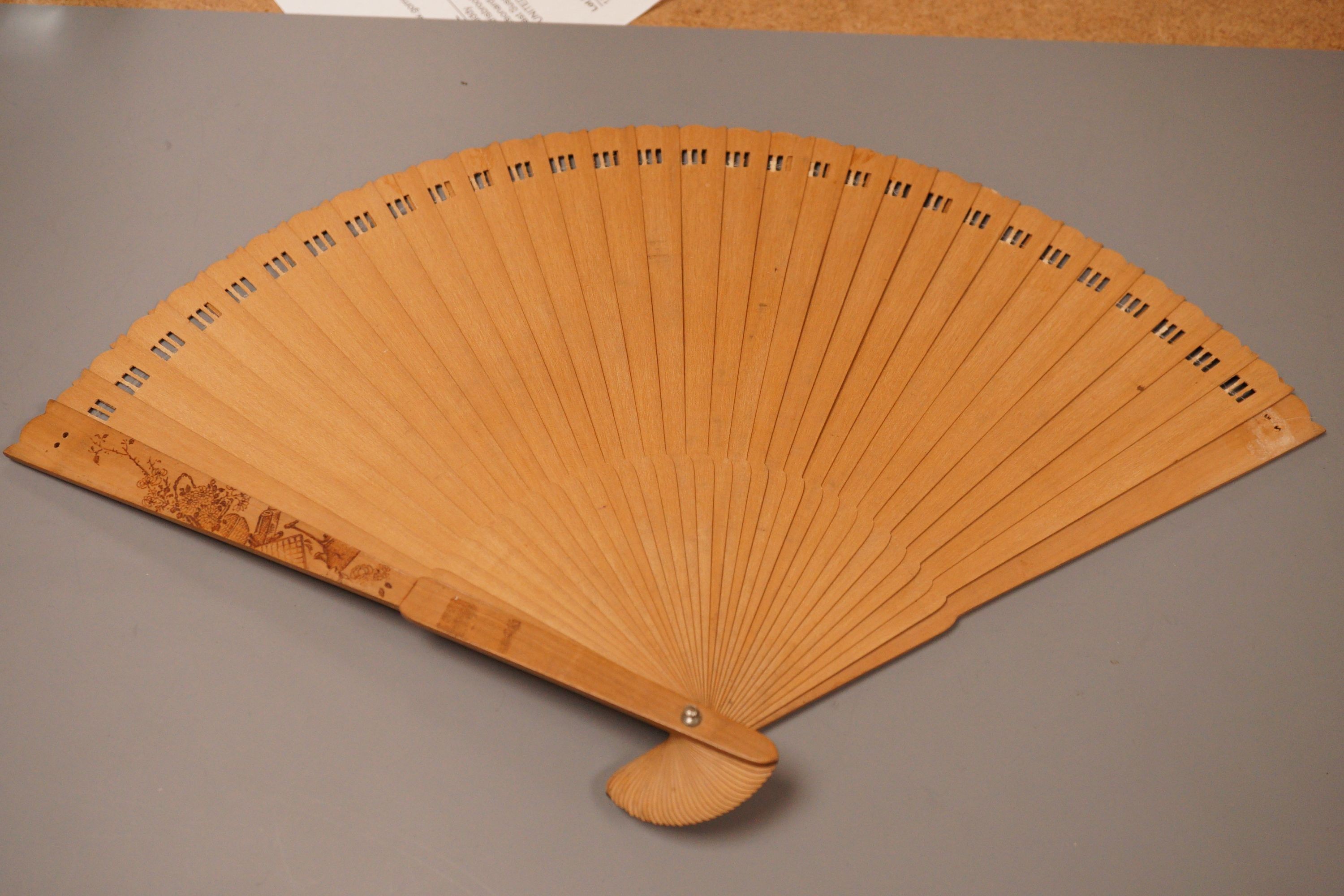 A Chinese penwork sandalwood fan